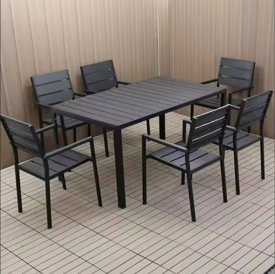 Outdoor Teak and Aluminium Dining Table with 4 Armchairs in an outdoor setting.