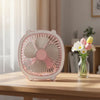 Fresh Color Box Desk USB Fan Rechargeable Cooling Fan on a desk beside a vase of flowers.