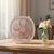 Fresh Color Box Desk USB Fan Rechargeable Cooling Fan on a desk beside a vase of flowers.