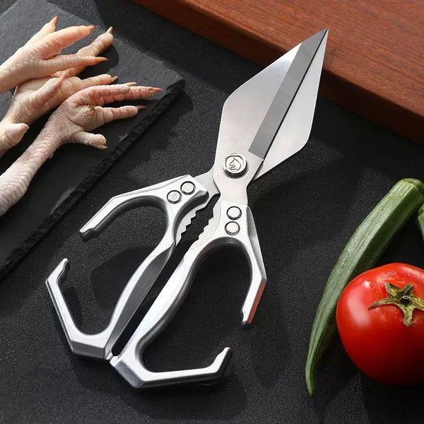 Strong Big Head Kitchen Scissors on a cutting board with vegetables and chicken feet.