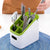 Modern Multifunctional Kitchen Countertop Storage Rack holding cutlery and utensils in the kitchen.