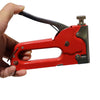 GS Manual Nail Staple Gun held in hand, perfect for DIY projects and home repairs.