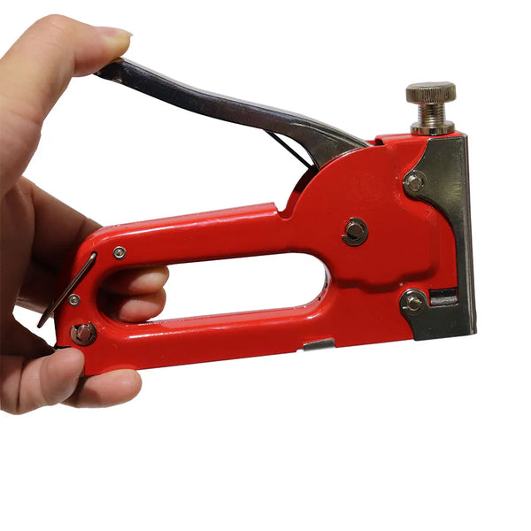 GS Manual Nail Staple Gun held in hand, perfect for DIY projects and home repairs.