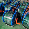 Durable Garden Irrigation Hose Reel with Hose neatly organized and ready for use in a garden setting.