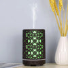 200ml Automatic Electric Plastic Aroma Diffuser emitting mist with green light in a stylish design.