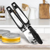 Stainless Steel Manual 3-in-1 Can Opener on a kitchen counter beside opened cans.