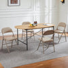 Black Padded Folding Chair with Steel Frame around a dining table, complementing the modern interior design.