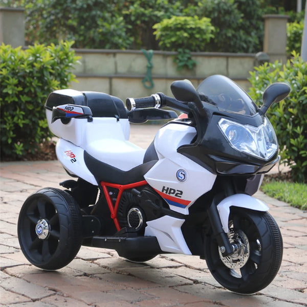 Kids Electric Motorcycle Ride on Car parked in a garden setting, showcasing a sleek design and sturdy wheels for toddlers.