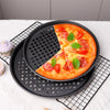 Non-Stick Carbon Steel Baking Cake Mold with a delicious pizza and fresh basil on top.