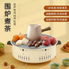 Portable Charcoal Grill & Outdoor Cooker with food and tea set, ideal for camping, picnics, and outdoor cooking.