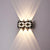 Waterproof Square Aluminum Tempered Glass LED Wall Light illuminating a wall with modern design and ambient lighting.