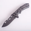 3D Embossed Dragon Folding Survival Knife with intricate dragon design on handle and sharp stainless steel blade.