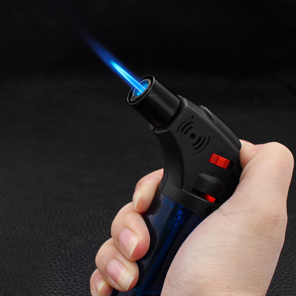 Refillable Butane Jet Torch Lighter 12 Piece Display in hand, igniting a blue flame for various uses.