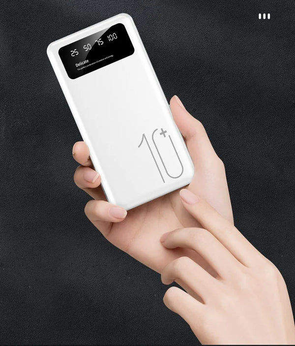 Super Slim Portable Mini Power Bank 10000mAh held in hand with LED display showing battery status
