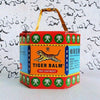 Red Tiger Medicated Cooling Relief Balm packaging displayed, featuring vivid colors and iconic tiger imagery.