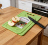 Mini Kitchen Chopping Board with Knife featuring sliced apples on a green cutting board in a kitchen setting.