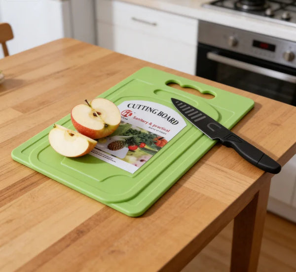 Mini Kitchen Chopping Board with Knife featuring sliced apples on a green cutting board in a kitchen setting.