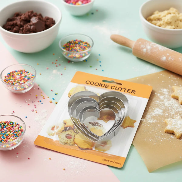 Classic 5 Piece Stainless Steel Cookie Cutter Set with heart shapes on a pastel baking countertop.