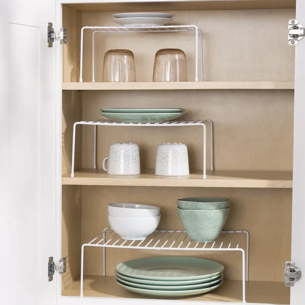 Single Layer Kitchen Metal Shelf Organizer displaying stacked plates and jars in a wooden cabinet.