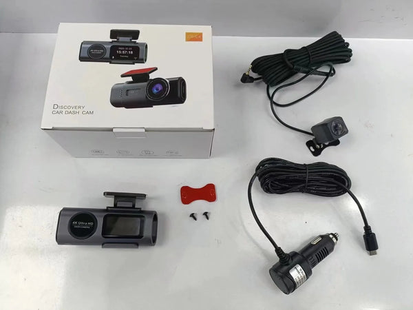 4K Dual UHD Front and Rear Dashcam with WiFi & GPS with accessories and packaging displayed on a flat surface.