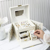Square Leather and Walnut Wood Jewelry Box opened with organized rings, necklaces, and accessories displayed.