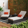 Outdoor Garden Lounge Daybed Wicker Deck Bed with white cushions and orange accents in a lush garden setting.