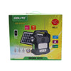 Outdoor IP65 Rechargeable Solar Light in packaging with solar panel, mobile charger, radio, and Bluetooth features.