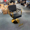 Professional Salon Hydraulic Styling Chair in black with gold accents, ideal for busy salons and beauty studios.