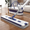 Hand Free Microfiber Mop with Foldable Bucket on a wooden floor with a complementary bucket in the background.
