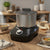 600W 4L Fufu Heating Machine YAM Pounder making traditional meals on a kitchen table with bowls and bread.