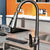 Brushed Grey Stainless Steel Pull Out Kitchen Faucet shown in a modern kitchen setting with sleek design.