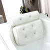 Non Slip Take Bath Pillow with Suction Cups placed on the edge of a bathtub for comfortable bathing.