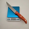 Stainless Steel Ultra Sharp Fruit Knife displayed on a scale showing 40.9g for lightweight precision in food preparation.