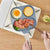 3 Hole Non Stick Die Cast Frying Pan with eggs, pancakes, and bacon, featuring non-stick compartments.