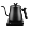 Stainless Steel Electric Home Kettle for Office Tea Kettle on a heating base.