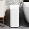 Covered Trash Can shown in a bathroom, with water splashing around it to illustrate its durable design.