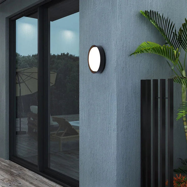 Waterproof Outdoor LED Corridor Ceiling Lamp illuminating a modern exterior wall beside a large window.