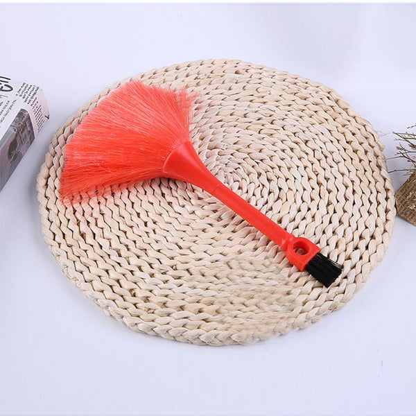 High Quality Plastic Duster on a woven mat, ideal for cleaning dust from tight spaces and delicate surfaces.