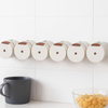 Magnetic Stainless Steel Spice Storage Box for organized seasoning on kitchen wall with black mug and pasta bowl.