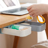 Hand reaching for an Invisible Hidden Stationery Case drawer under a desk, showcasing tidy stationery organization.
