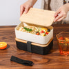 Lightweight Microwave-Safe Bento Lunch Box filled with pasta, vegetables on a wooden table with a drink.