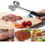 Double-Sided Stainless Steel Meat Tenderiser Hammer tenderizing meat on a cutting board with fresh ingredients.