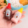 Mini 30ml Plastic Squeeze Bottles with honey mustard and soy sauce in hand