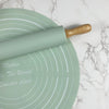 Non-Stick Silicone Rolling Pin & Pastry Mat Baking Set on a marble surface with measurement markings.