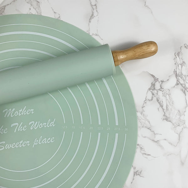 Non-Stick Silicone Rolling Pin & Pastry Mat Baking Set on a marble surface with measurement markings.
