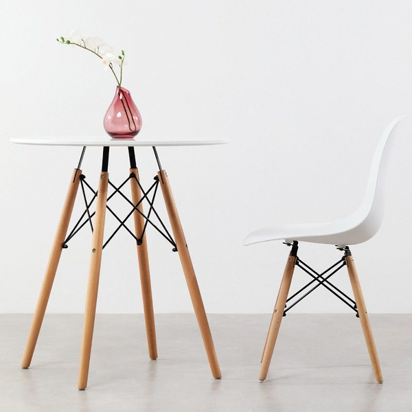 75cm Modern Eames Design Round Dining Table with chair and decorative vase.