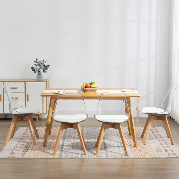 Scandinavian Transparent Elk Dining Chair set around a wooden dining table in a modern interior space.