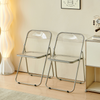Modern Transparent Folding Chair in a contemporary living space, featuring a sleek design and clear seat.