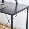 SD-23 L-Shaped Computer Gaming Desk with black surface and hooks for accessories.