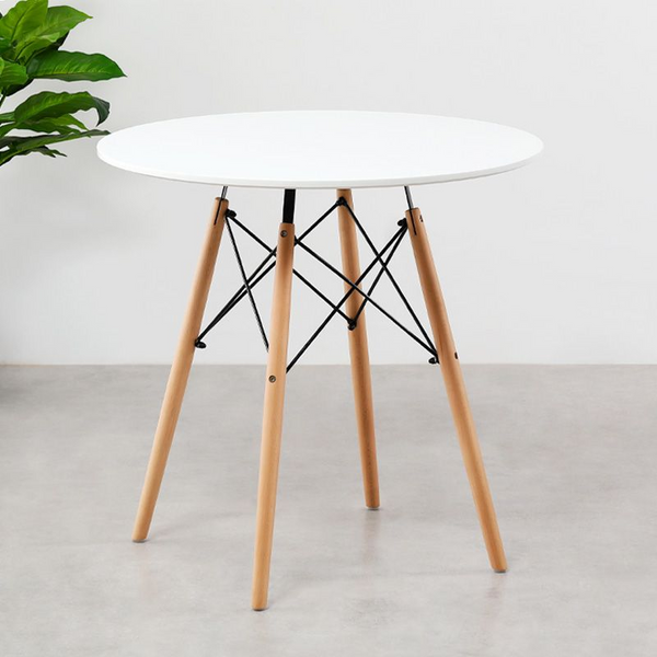 75cm Modern Eames Design Round Dining Table with white top and wooden legs in a modern setting.